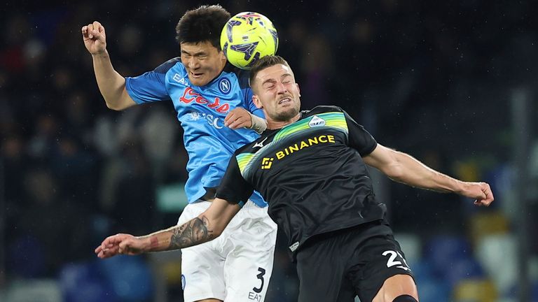 Napoli&#39;s Kim Min-Jae battles for a head ball with Lazio&#39;s Elseid Hysaj during the Serie A soccer match between Napoli and Lazio, at the Diego Armando Maradona stadium in Naples, Italy, Friday, March 3, 2023. (Alessandro Garofalo/LaPresse via AP)