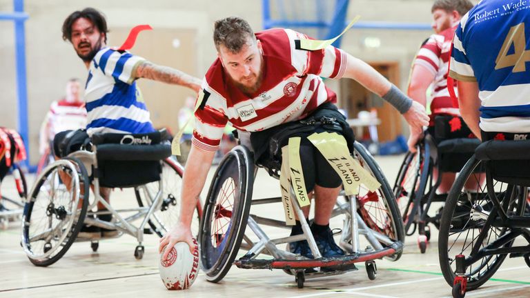 Matt Wooloff dots down for a try in Wigan's season-opening win against champions Halifax