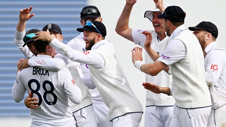 England&#39;s Harry Brook, second left, is congratulated by teammates after taking the wicket of New Zealand&#39;s Kane Williamson on day 4 of their cricket test match in Wellington, New Zealand, Monday, Feb 27, 2023. (Andrew Cornaga/Photosport via AP)