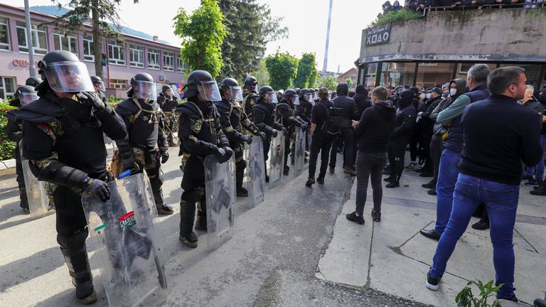 Hungarian soldiers serving in the NATO-led peacekeeping force KFOR guard a municipal building in the town of Zvecan, northern Kosovo, Monday, May 29, 2023. Serbia condemned NATO-led peacekeepers stationed in neighboring Kosovo for their alleged failure to stop "brutal actions" by Kosovo police against ethnic Serbs, and said that its armed forces stationed near the border will remain on the highest state of alert until further notice. (AP Photo/Bojan Slavkovic)