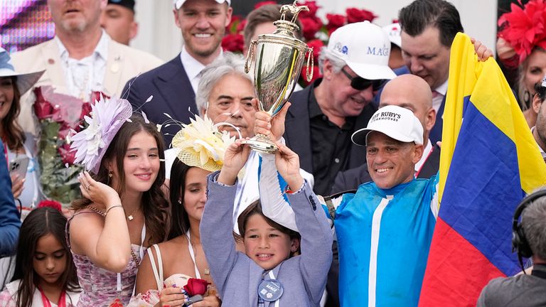 Javier Castellano, right, celebrates after riding Mage to win the 149th running of the Kentucky Derby