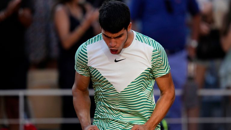 Spain&#39;s Carlos Alcaraz celebrates after beating Italy&#39;s Lorenzo Musetti during their fourth round match of the French Open tennis tournament at the Roland Garros stadium in Paris, Sunday, June 4, 2023. (AP Photo/Thibault Camus)