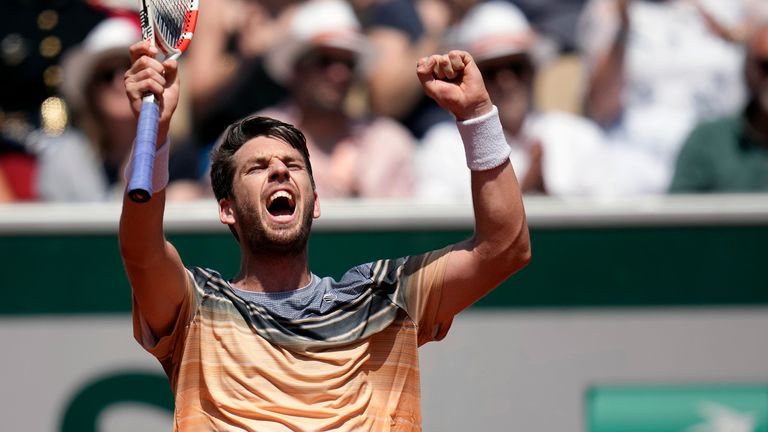 Britain&#39;s Cameron Norrie celebrates after beating France&#39;s Benoit Paire during their first round match of the French Open tennis tournament at the Roland Garros stadium in Paris, Monday, May 29, 2023. (AP Photo/Christophe Ena)