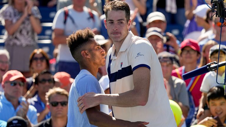 John Isner, of the United States, reacts as he congratulates Michael Mmoh, of the United States, after losing to Mmoh in the second round of the U.S. Open tennis championships, Thursday, Aug. 31, 2023, in New York. (AP Photo/John Minchillo)