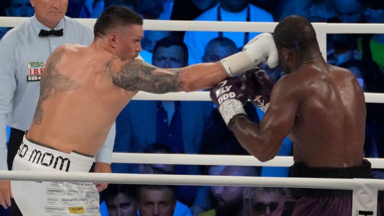 Ukraine&#39;s Oleksandr Usyk, left, lands a blow on Britain&#39;s Daniel Dubois during their world heavyweight title fight at Tarczynski Arena in Wroclaw, Poland, Sunday, Aug. 27, 2023. Oleksandr Usyk defends his WBC, IBF and WBA heavyweight titles for the first time in a year when he faces hard-hitting British challenger Daniel Dubois in a clash of styles. (AP Photo/Czarek Sokolowski)