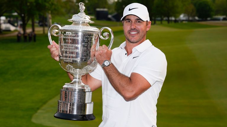 Brooks Koepka holds the Wanamaker Trophy after winning the PGA Championship