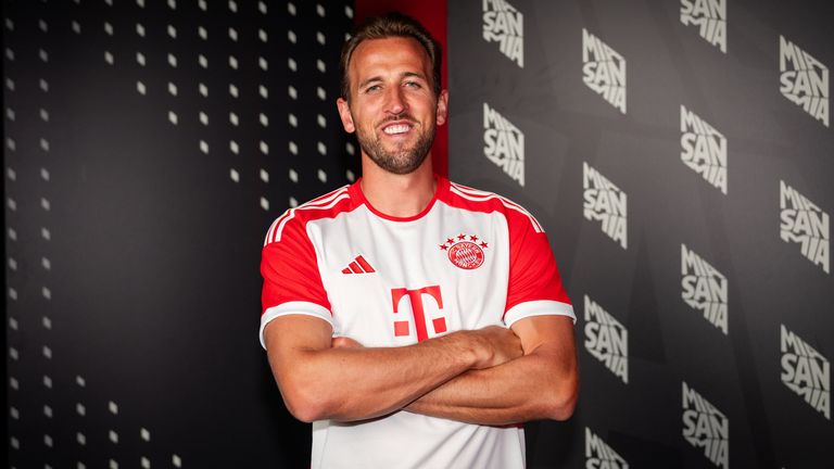 Harry Kane poses for photographs after signing for Bayern Munich