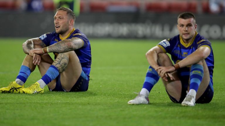 Josh Griffin (left) and Max Jowitt look dejected as Wakefield Trinity's relegation is confirmed