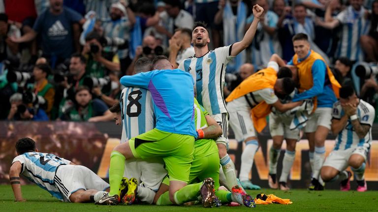 Argentina&#39;s Nicolas Tagliafico celebrates with team mates after the World Cup final soccer match between Argentina and France at the Lusail Stadium in Lusail, Qatar, Sunday, Dec. 18, 2022. (AP Photo/Frank Augstein)