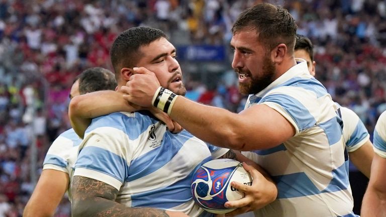 Argentina's Joel Sclavi is congratulated by his team-mates after scoring his try