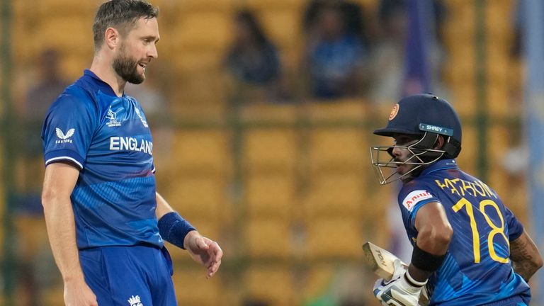 England&#39;s Chris Woakes reacts after Sri Lanka&#39;s Pathum Nissanka hits a four on his delivery during the ICC Men&#39;s Cricket World Cup match between England and Sri Lanka in Bengaluru, India, Thursday, Oct. 26, 2023. (AP Photo/Aijaz Rahi)