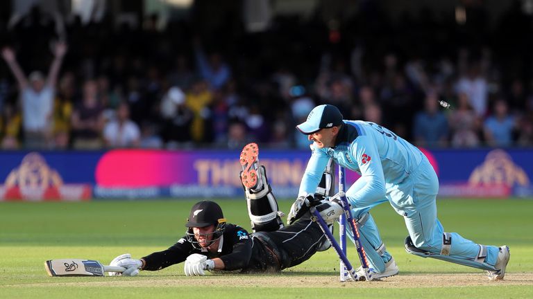 England&#39;s Jos Buttler runs out New Zealand&#39;s Martin Guptill during the Super Over to win the Cricket World Cup final match