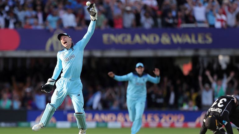 England&#39;s Jos Buttler celebrates after running out New Zealand&#39;s Martin Guptill during the Super Over in the Cricket World Cup finalin 2019