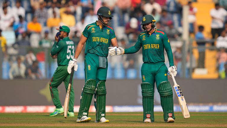 South Africa&#39;s Aiden Markram and Quinton De Kock celebrate their milestones against Bangladesh