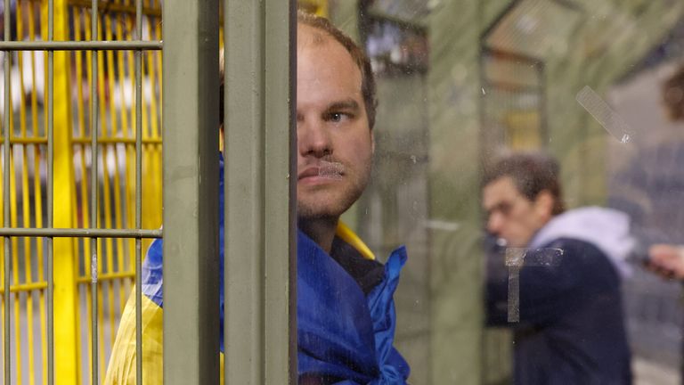 A Swedish fan at the King Baudouin Stadium reacts after Sweden&#39;s Euro 2024 Qualifier against Belgium is abandoned following a shooting in Brussels