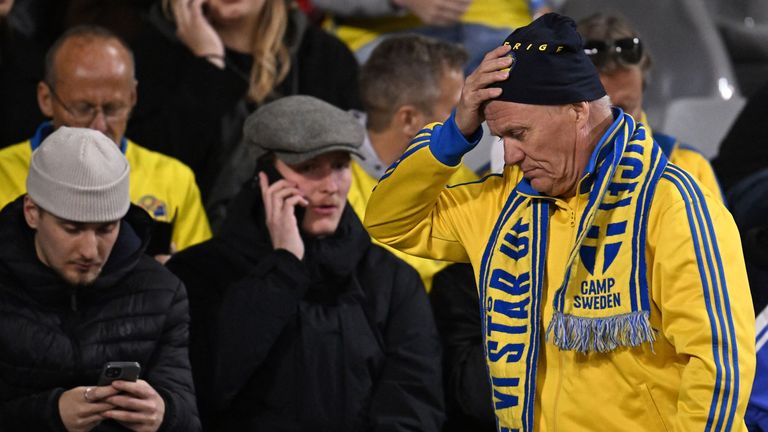 Swedish fans at the King Baudouin Stadium react after Sweden&#39;s Euro 2024 Qualifier against Belgium is abandoned following a shooting in Brussels