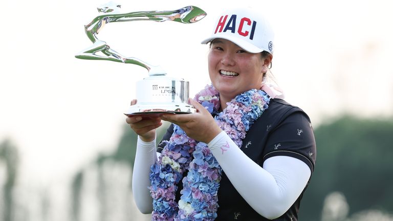 Angel Yin poses with the Shanghai Champion Trophy