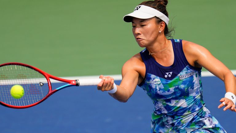 Yuriko Lily Miyazaki, of Great Britain, returns a shot to Belinda Bencic, of Switzerland, during the second round of the U.S. Open tennis championships, Wednesday, Aug. 30, 2023, in New York. (AP Photo/Manu Fernandez)