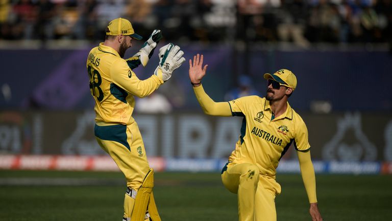 Australia&#39;s Josh Inglis, left, and Mitchell Starc celebrates the dismissal of New Zealand&#39;s Devon Conway during the ICC Men&#39;s Cricket World Cup match between Australia and New Zealand in Dharamshala, India,Saturday, Oct. 28, 2023. (AP Photo/Ashwini Bhatia)


