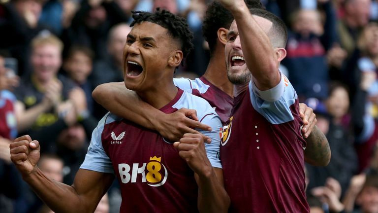 Ollie Watkins celebrates after completing his hat-trick against Brighton