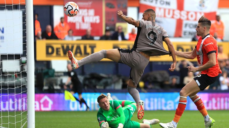 Tottenham&#39;s Richarlison (left) heads wide of the goal