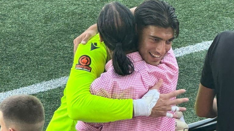 6ft 5in Punjabi shot-stopper Rohan Luthra embraces Sky Sports News&#39; Dev Trehan after his first clean sheet for Slough Town