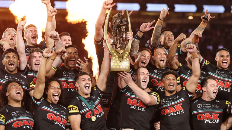 Nathan Cleary (left) and Isaah Yeo lift the Provan-Summons Trophy