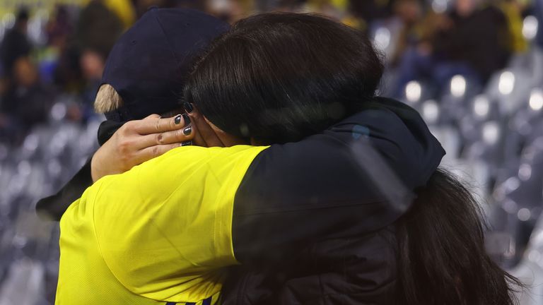 Swedish fans at the King Baudouin Stadium react after Sweden&#39;s Euro 2024 Qualifier against Belgium is abandoned following a shooting in Brussels