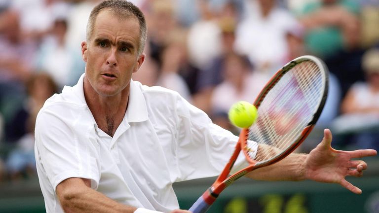 Todd Martin from the USA in action against Gustavo Kuerten of Brazil on Court One at the All England Lawn Tennis Championships in Wimbledon . Martin won in straight sets 7:6/6:4/6:4.