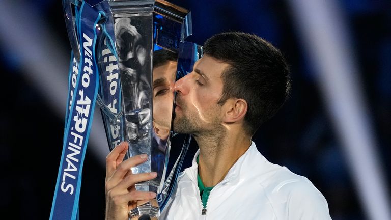 Serbia&#39;s Novak Djokovic poses with his trophy after defeating Norway&#39;s Casper Ruud 7-5, 6-3, in the singles final tennis match to win the ATP World Tour Finals at the Pala Alpitour, in Turin, Italy, Sunday, Nov. 20, 2022. (AP Photo/Antonio Calanni)