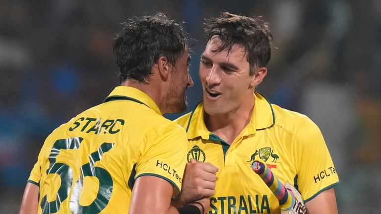 Australia&#39;s captain Pat Cummins and Mitchell Starc celebrate their win in the ICC Men&#39;s Cricket World Cup second semifinal match with South Africa in Kolkata, India, Thursday, Nov. 16, 2023. (AP Photo/Bikas Das)