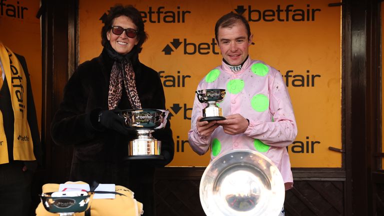 Charlie Deutsch celebrates winning the Betfair Chase at Haydock on Royale Pagaille alongside trainer Venetia Williams