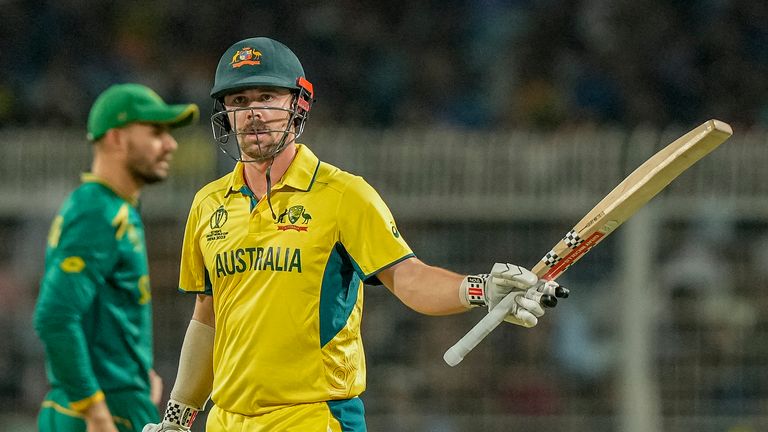 Australia&#39;s Travis Head raises his bat as he celebrates after a 40-ball fifty against South Africa 