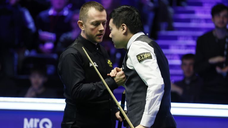 Mark Allen (left) is beaten by Ding Junhui at the UK Championship in York