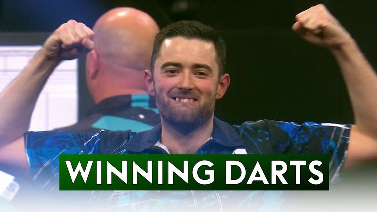 Luke Humphries takes out a 91 finish to defeat Rob Cross 16-8 and win his first Grand Slam of Darts title.