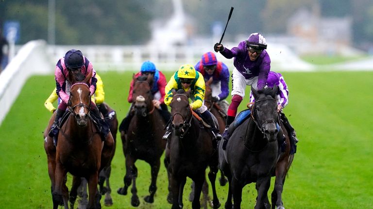 Dettori celebrates as King Of Steel wins the Qipco Champion Stakes