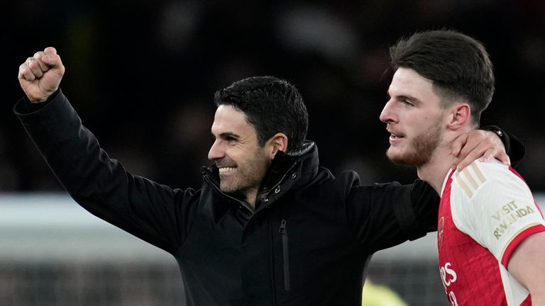 Arsenal&#39;s manager Mikel Arteta, left, and Declan Rice celebrate at the end of the English Premier League soccer match between Arsenal and Burnley at Emirates stadium in London, England, Saturday, Nov. 11, 2023. Arsenal won 3-1. (AP Photo/Kin Cheung)