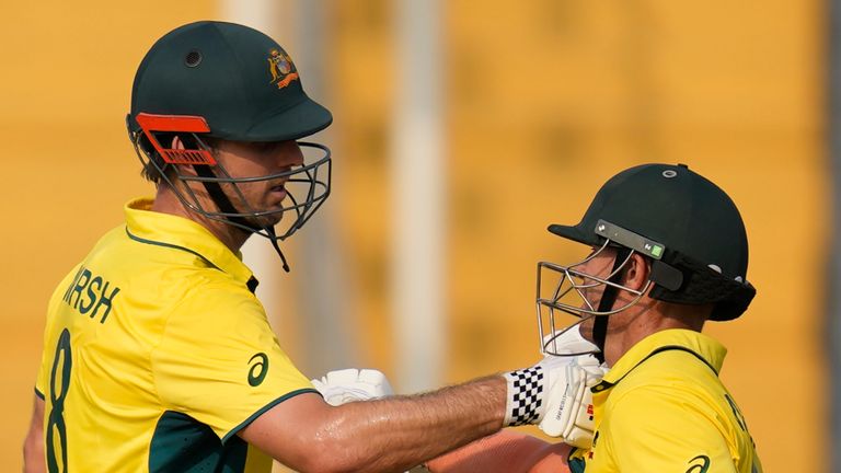 Australia&#39;s Mitchell Marsh celebrates his fifty runs with David Warner during the ICC Men&#39;s Cricket World Cup match between Australia and Bangladesh in Pune, India, Saturday, Nov. 11, 2023. (AP Photo/Rafiq Maqbool)