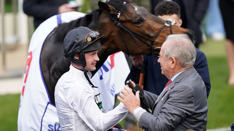 Jockey Nico de Boinville and owner Michael Buckley celebrate winning the Sky Bet Supreme Novices&#39; Hurdle with Constitution Hill during day one of the 2022 Cheltenham Festival