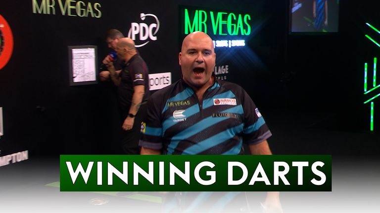 Rob Cross finds his favorite double 18 to defeat Nathan Aspinall and seal a quarter-final spot in the Grand Slam of Darts.