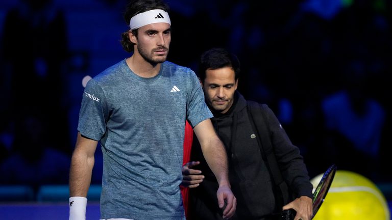 Greece&#39;s Stefanos Tsitsipas leaves the court after injuring during the singles tennis match against Denmark&#39;s Holger Rune, of the ATP World Tour Finals at the Pala Alpitour, in Turin, Italy, Tuesday, Nov. 14, 2023. (AP Photo/Antonio Calanni)