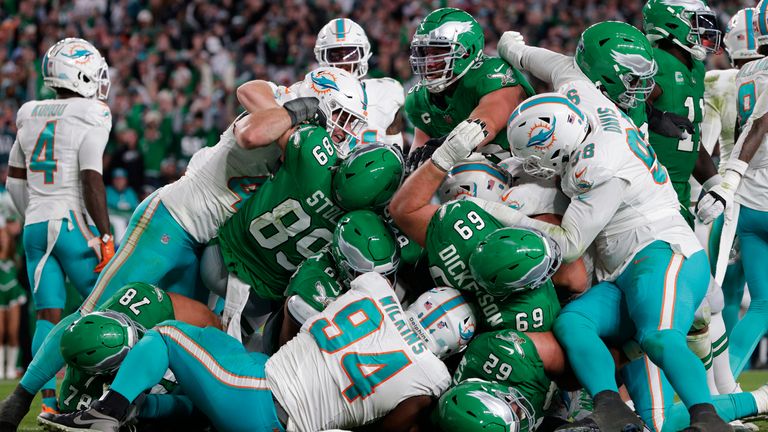 Philadelphia Eagles quarterback Jalen Hurts scores on a Tush Push against the Miami Dolphins 