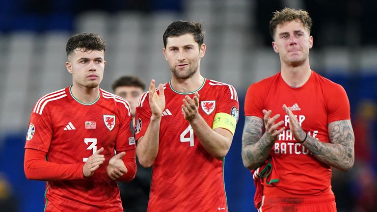 Captain Ben Davies applauds the crowd at the Cardiff City Stadium