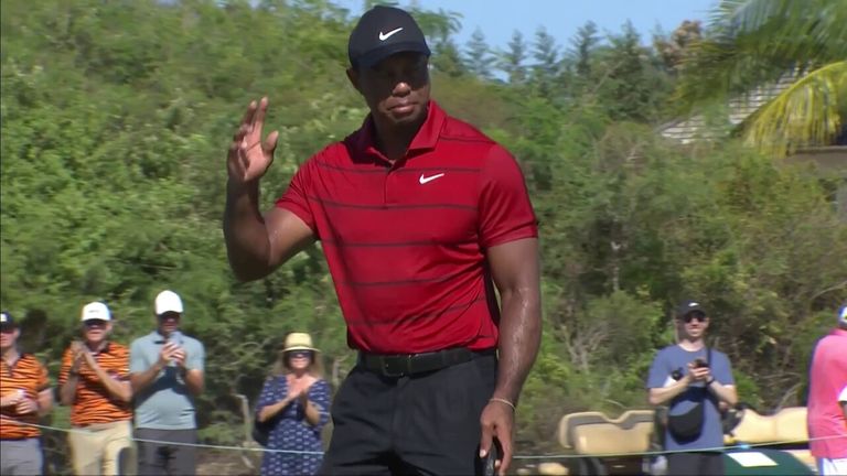 Tiger Woods drains the birdie putt from 34 feet out on the par-three fifth at the Hero World Challenge.