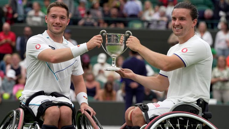 Alfie Hewett (left) and teammate Gordon Reid celebrate with after winning against Japan&#39;s Takuya Miki and Japan&#39;s Tokito Oda during the men&#39;s wheelchair doubles final at Wimbledon 