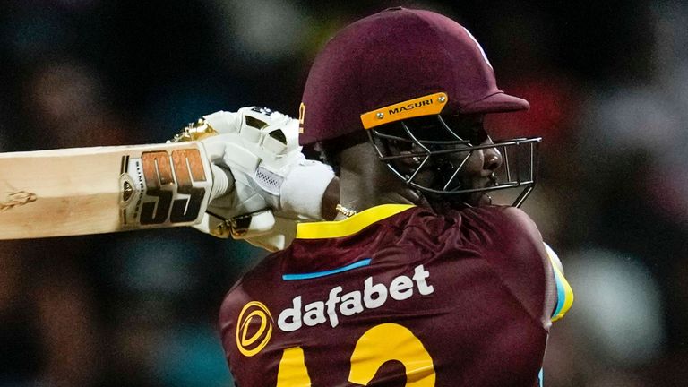 West Indies&#39; Rovman Powell hits the winning runs during the first T20 cricket match against England at Kensington Oval in Bridgetown, Barbados, Tuesday, Dec. 12, 2023. (AP Photo/Ricardo Mazalan) 