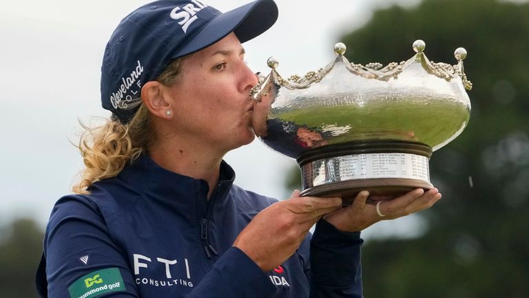 Ashleigh Buhai kisses the trophy after winning the women's Australian Open