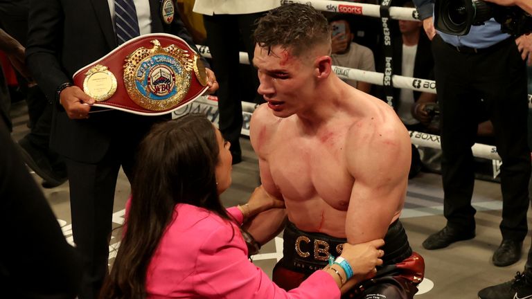 Chris Billam-Smith with his wife after his world title victory