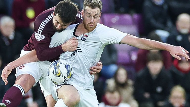 EDINBURGH, SCOTLAND - DECEMBER 30: Hearts&#39; Craig Halkett and Ross County&#39;s Jordan White during a cinch Premiership match between Heart of Midlothian and Ross County at Tynecastle Park, on December 30, 2023, in Edinburgh, Scotland. (Photo by Roddy Scott / SNS Group)