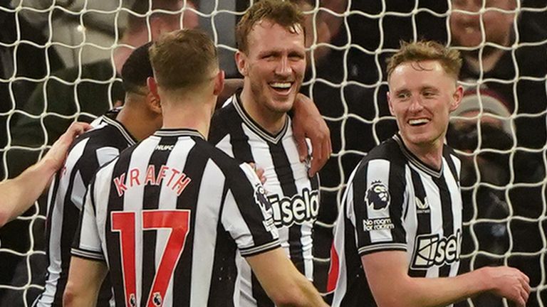 Dan Burn is congratulated by team-mates after making it 3-0